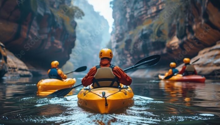 Group kayaking in a canyon adventure and exploration dramatic lighting enjoying leisure activities